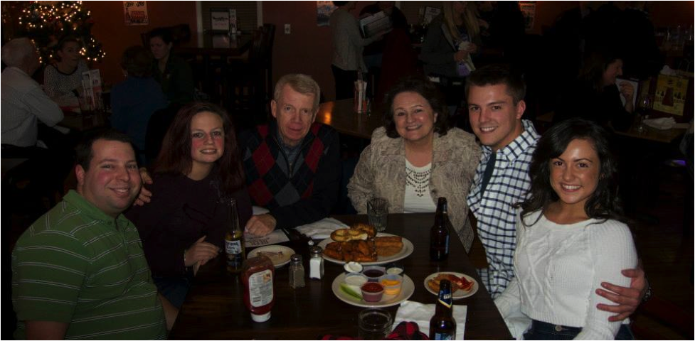 Julie is pictured here (from left to right) with her sister’s Boyfriend Dave, sister Lindsay, Dad, Mom, and Boyfriend Derek at a family get together around the Holidays 2014. (Victor, NY)